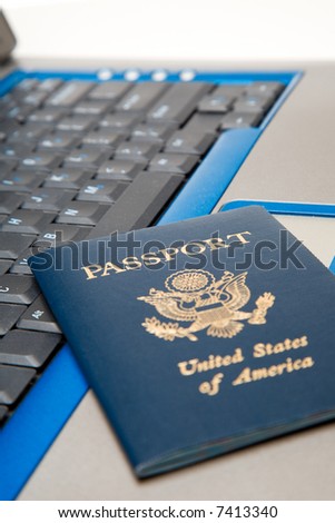 A shot of a passport and a laptop, can be used for online travel booking concept