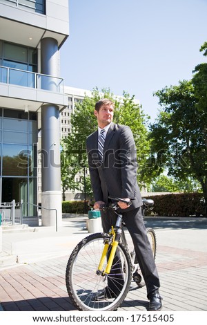 A caucasian businessman riding a bike to work