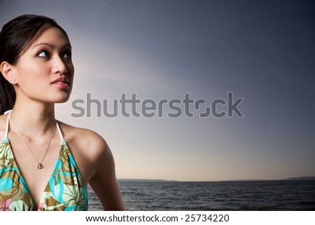 A beautiful sexy asian woman in bikini on the beach