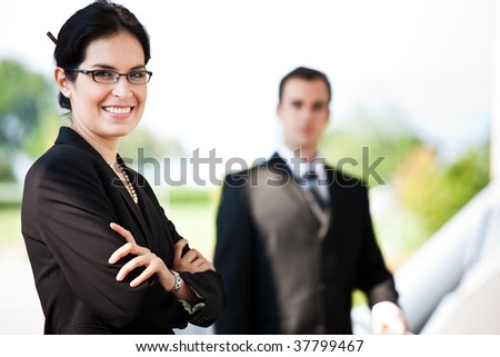A shot of two happy business people standing outdoor