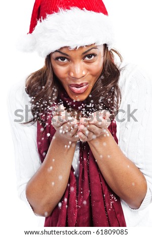 An isolated shot of a black woman celebrating christmas wearing santa hat
