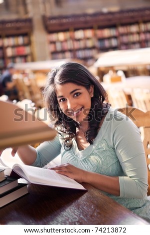 A shot of an asian student studying in a library