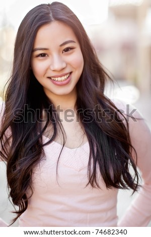 A shot of a beautiful asian woman outdoor