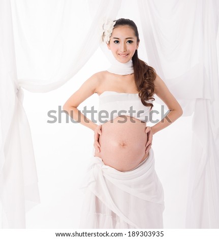 asian pregnant woman with angel wings