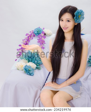 girl sitting on flower sofa