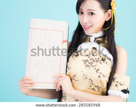 young chinese girl holding a Calligraphy book asian cheongsam tradition