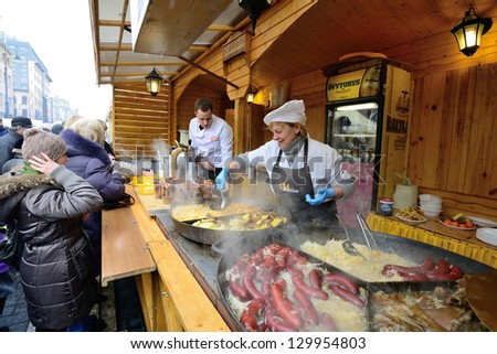 VILNIUS, LITHUANIA - MARCH 1: Unidentified people trades food in annual traditional crafts fair - Kaziuko fair on Mar 1, 2013 in Vilnius, Lithuania