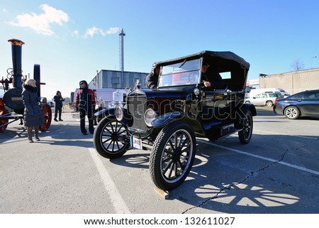KAUNAS, LITHUANIA - MAR 23: Antique car show in a traditional flea market in second biggest Lithuanian city - Kaunas, on March 23, 2013 in Kaunas, Lithuania