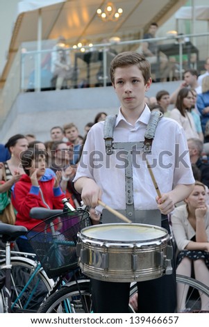 VILNIUS, LITHUANIA - MAY 18: Unidentified musician play drums and other instrument in Street music day on May 18, 2013 in Vilnius. Its a most popular event on May in Vilnius, Lithuania
