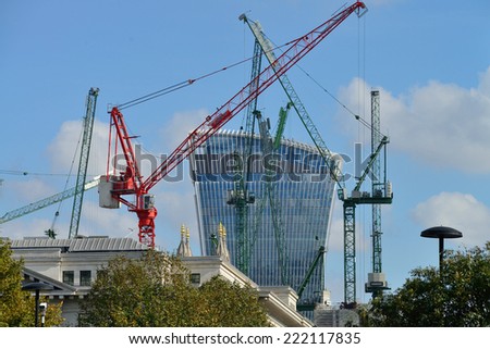 LONDON - OCTOBER 03: Building site with cranes on October 03, 2014 in London, UK. City of London is one of the leading centres of global finance.