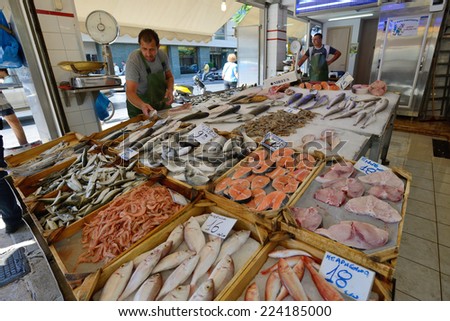 CHANIA, GREECE - AUGUST 13: Unknown people sell freh fish in Chania, Crete, Greece on 13 August 2014. The cross-shaped market (Agora) of Chania was built in 1911-1913.