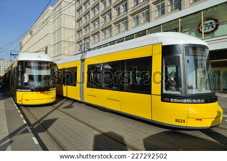 BERLIN, OCTOBER 27: Yellow tram in city street on October 27, 2014 in Berlin, Germany. The tram in Berlin is one of the oldest tram systems in the world.