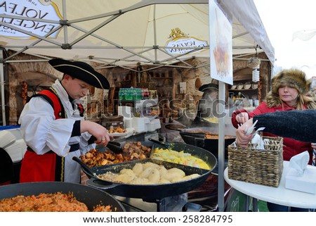 VILNIUS, LITHUANIA - MARCH 6: Unidentified people trade food in annual traditional crafts fair - Kaziuko fair on Mar 6, 2015 in Vilnius, Lithuania
