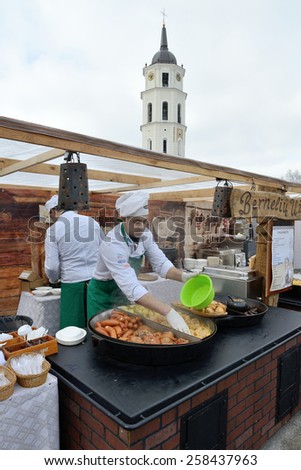 VILNIUS, LITHUANIA - MARCH 6: Unidentified people trade food in annual traditional crafts fair - Kaziuko fair on Mar 6, 2015 in Vilnius, Lithuania