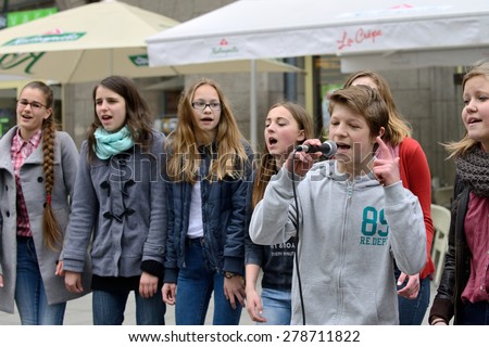 VILNIUS, LITHUANIA - MAY 16: Unidentified musician sing and dancing in Street Music Day on May 16, 2015 in Vilnius. Its a most popular event on May in Vilnius, Lithuania