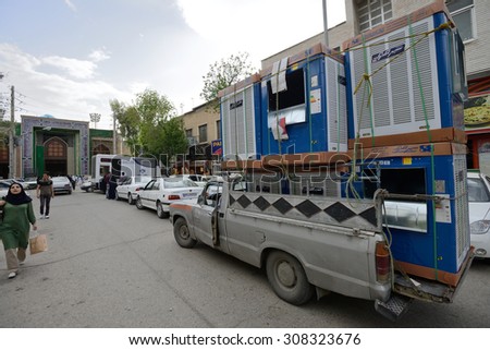 SHIRAZ - APRIL 14: Overloaded car in a market (Vakil Bazaar) in Shiraz, Iran on April 14, 2015. Vakil Bazaar is the most important tourist attraction in Shiraz, Iran.