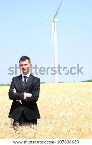 Business man at wind farm