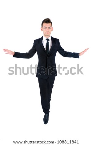 Isolated young business man moving on rope