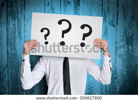 Business man cover face with question  board