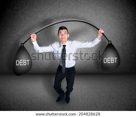 Business man lift weights with debt
