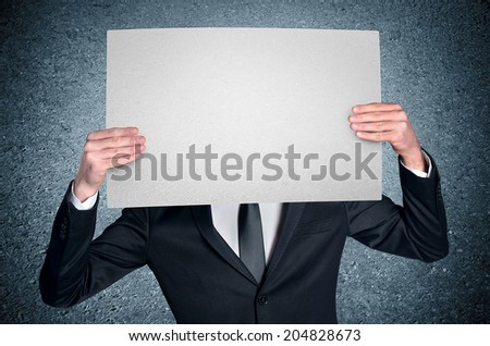 Business man cover face with empty board