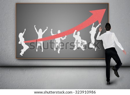 Business man drawing success team on blackboard