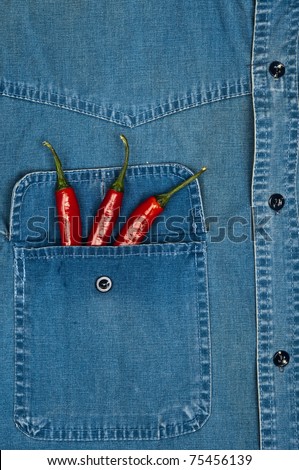 Jeans shirt pocket with red pepper