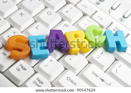 Search word made by colorful letters on keyboard