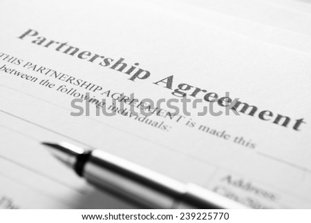 Close up Partnership Agreement Paper and Pen, Emphasizing the Title Part.