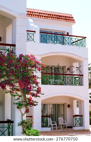Facade of Hotel with balconies and windows decorated with flowers Sharm El Sheikh, Egypt