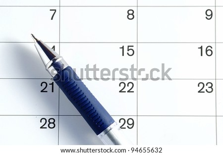 ballpoint pen on the page is a calendar to mark the date