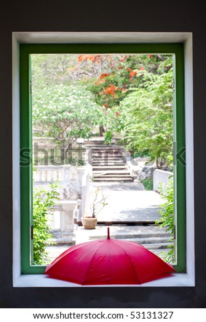 Windows and red umbrella.