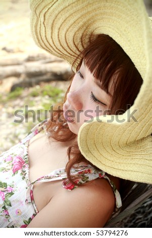 woman hammock sleep on the beach in Thailand.