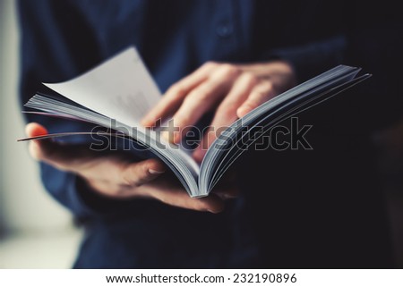 man reading a magazine