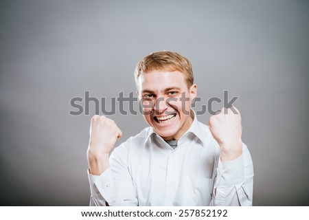 Portrait Of  Smiling Man With The Fists Up