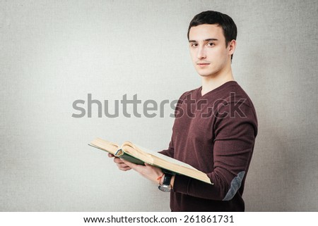stylish man reading a big book