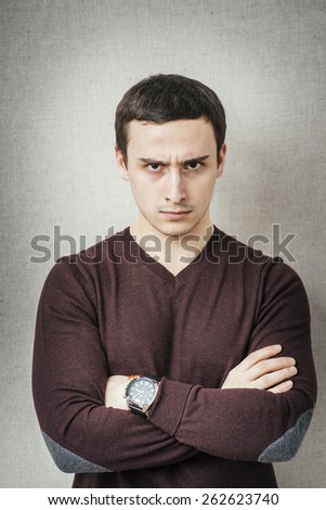 Portrait of disgusted man looking at the camera