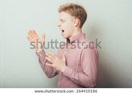 young man trying to scare someone