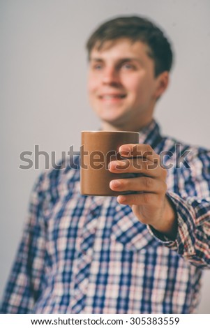 man with a cup of tea or cocoa