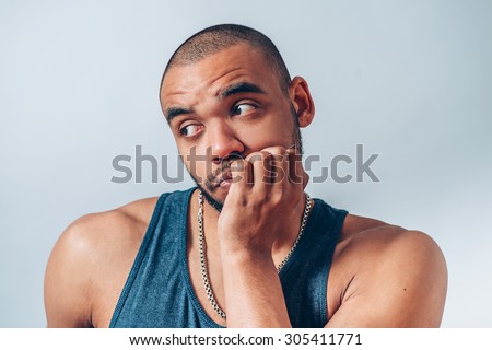 black man backs his chin with his fist