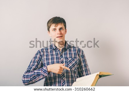 stylish man reading a big book