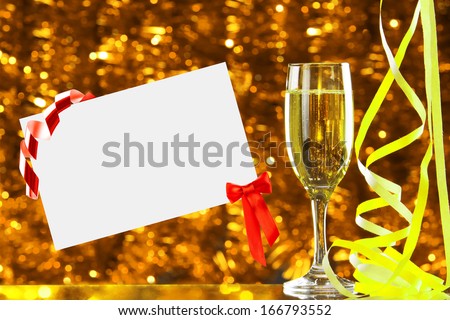 Glass of champagne and empty card