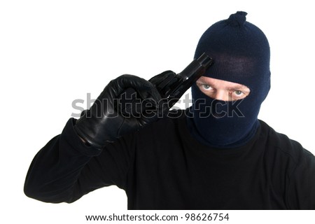 Burglar with a gun - isolated on white