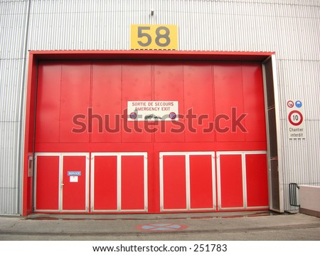 Oversized red metal emergency doors