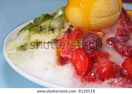 Shaved ice dessert with fruits and icecream