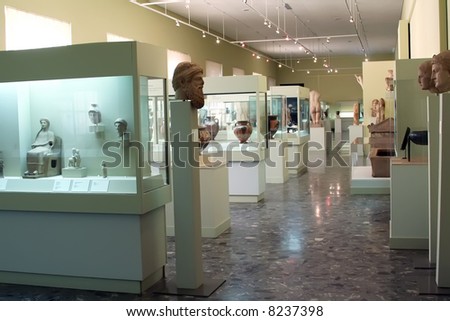Museum exhibits of ancient relics in glass cases