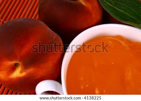 Peach jelly on white background in jar-desser