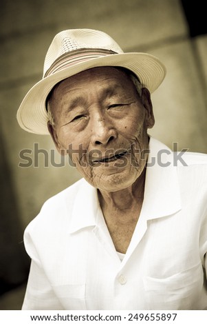 Seoul, Korea - July 2012. An elderly Korean man is in pagoda park in Seoul, Korea in July 2012.