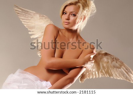 Beautiful young woman with christmas-like angel wings