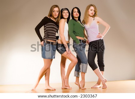 four girls standing on the wood floor with bare feets. Photo is a part of small sequented serie
